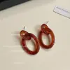 Pendientes Dobles Geométricos Huecos de Ámbar Estilo Retro Hong Kong con un Toque de Alta Gama, Pendientes de Moda Degradados, Suministro de Fábrica para Mujeres