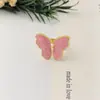 Diseño de Nicho Anillo de Flor de Cuatro Pétalos con Goteo Dulce de Aceite Anillo de Acero de Titanio Pequeño Fresco Femenino Joyería para Mujeres Venta al por Mayor