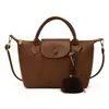 Nova bolsa de ombro trançada simples e estilosa para o dia a dia de outono, bolsa tipo balde da moda, bolsa transversal feminina estilo coreano