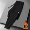 Pantalones casuales de otoño e invierno para hombre, forrados de polar, engrosados, de corte holgado, pantalones largos versátiles, pantalones casuales, pants deportivos, versátiles y modernos