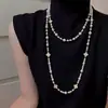 Colección Larga de Collares Superpuestos de Perlas Swarovski para Mujer, Estilo Lujo Ligero, Cadena Versátil para Suéter con un Toque de Alta Gama, Venta al por Mayor Otoño e Invierno