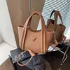Bolsa Saco de Textura de Alto Padrão para Comércio Exterior para Mulheres 2025 Nova Super Popular Nicho Bolsa de Ombro Moda Bolsa Transversal para o Dia a Dia