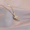 Collar para Mujer Moda Nicho Nuevo Diseño Colgante Celebridad de Internet Flor de Zircón Bauhinia Giratoria Temperamento Collar de Acero Titanio