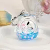 Muñeca de Pegatina Botella de Arena Movediza Llavero Flotando en Botella de Aceite Regalo Venta al por Mayor Colgante para Mochila Escolar Llave de TV Creativa
