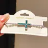 Pulsera de cruz de circón estilo francés para mujer, sensación de lujo ligero y alta gama, joyería vintage única y de moda con un diseño de nicho
