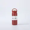 Taza elemento de acero inoxidable 304 para estudiantes, taza aislada de alta estética para hombres y mujeres, botella de agua portátil para exteriores con asa, venta al por mayor desde el fabricante