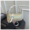 Bolsa Pequena de Palha Tecida de Designer para Mulheres 2025 Novo Estilo Bolsa Transversal Tecida de Férias Moda Versátil Balde de Praia Bolsa de Ombro