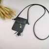 Venta al por mayor de fábrica moda estilo pequeño colgante de borla funda cruzada para teléfono tarjeta monedero multiusos de alta calidad