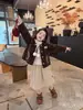 Casaco Peludo Infantil Outono/Inverno 2026 Novo Top de Pelúcia Infantil Bebê Acolchoado Bolinhas Estilo Coreano Casaco de Lã de Cordeiro Algodão