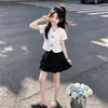 Conjunto de Moda de Verano 2026: Conjunto de Dos Piezas: Top Floral Dulce y Fresco de Manga Corta y Falda Elegante de Varios Niveles