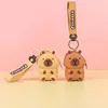 Bolsa de almacenamiento colgante con llavero de monedero de silicona de dibujos animados, mini bolsa portátil con cremallera para monedas y auriculares, venta al por mayor