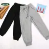 Otoño 2026 Nuevo Pantalón de Chándal Rayado con Retazos de Algodón Hua para Niños Niñas Pantalones Casuales Pantalones Deportivos Pantalones Largos con Puño