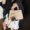 Bolsa de balde portátil de alta costura feminina 2025 nova de primavera bolsa tote de lona versátil bolsa tiracolo popular