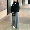 Falda midi plisada tejida de pelo de mapache engrosado para mujer, nuevo estilo otoño/invierno 2026, versátil, adelgazante, con una caída fluida y un dobladillo ancho, a la moda