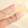 Cadena doble hebilla de oreja femenina temperamento simple personalidad de celebridad de Internet cadena de oreja Círculo de viento frío pendientes para doble perforación en la oreja