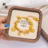 Método antiguo arena dorada cinco emperadores dinero cinco caminos bolsa de la fortuna estrellas diseño de estilo nacional pulsera DIY de arena dorada natural para novia