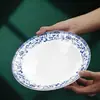 Conjunto de decoração de mesa de cerâmica estilo chinês para hotel restaurante restaurante Tigela e prato comercial conjunto de quatro peças resistente a altas temperaturas cor sob esmalte Alto senso