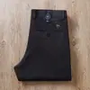 Estación europea otoño e invierno azul gris súper suave elástico en cuatro direcciones sarga de algodón sin planchar antiarrugas pantalones casuales rectos holgados para hombre