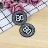 Marca de ropa de goma blanda de PVC creativa moda plástico de gota logo para zapatos y sombreros bolsos etiqueta de pecho para uniforme escolar disponible