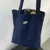 Bolsa de Lona de Mezclilla para Hombres y Mujeres Gran Capacidad 2025 Nueva Bolso de Hombro Tote para el Trabajo y Ropa de Trabajo Relajado Bolso de Mano de Alta Gama