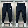 Pantalones Deportivos Casuales de Rayas Finas Sueltos de Secado Rápido para Hombre Marca de Moda Juvenil Elegante Versátil Pantalones Jogger