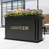 Caja de flores de acero inoxidable para exteriores combinación soporte de flores de hierro departamento de ventas valla de plantación verde partición canaleta para flores cama de flores exterior de restaurante
