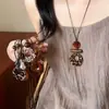 Collar de borlas acrílicas transfronterizo europeo y americano, sensación de lujo ligero y alta gama, cadena para la clavícula con diseño Maillard, joyería de nicho para mujeres