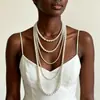 Colar longo de pérolas multicamadas para mulheres, primorosamente trabalhado, com um design ousado e único, oferecendo um toque vintage de alto padrão, adequado como corrente de suéter, luxo leve e estilo de nicho