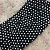 Falda corta mini plisada bodycon dulce y picante de línea A adelgazante Harajuku Y2K de lunares sexy caliente moda callejera retro de verano