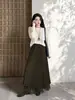 Elegante falda asimétrica reversible Feiyuan para mujer, nueva moda otoño e invierno, versátil, color liso, dobladillo ancho, falda midi