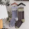 Calcetines retro cálidos de punto con volantes hasta la mitad de la pantorrilla para primavera, otoño e invierno, estilo coreano, con bloques de color a rayas de moda, dulces y lindos, versátiles para hombres y mujeres