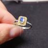 Joyería tesoro de color directo de fábrica plata 925 oro incrustado anillo de piedra lunar azul natural mujeres una generación de cabello