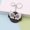 En Stock Pequeño Mini Búho Llavero Colgante de Cuero Búho de Dibujos Animados Alas Giratorias Adorno
