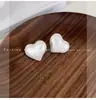 Clipe de orelha branco simples com gotas de óleo, novo design de nicho, alta qualidade, luxo leve, brincos sem furo de alta qualidade