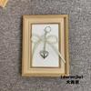 En stock, venta al por mayor, colgante de bolso de amor con lazo de perla, exquisito colgante de mochila escolar coreana, llavero de perla hecho a mano
