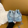 Bolso de mano pequeño para mujer 2025 nuevo de verano con cordón tipo cubo versátil estampado floral cadena ins bandolera