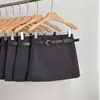Falda elegante y versátil de lana negra para mujer, ideal para otoño e invierno. Falda sexy de talle alto y corte en A.