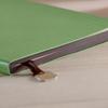 Amazon transfronterizo Cubierta de cuero PU verde cuero suave borde dorado interior grabado colgante cuaderno de cuero