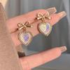 Elegantes pendientes de lujo de alta calidad con forma de lazo y diseño de nicho moderno y elegante para mujer.