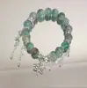 Pulsera de Cristal Verde Estilo Bosque Mariposa Media Pulsera Rígida para Hombres y Mujeres, Moderna y Elegante, Realza el Cutis, Regalo de Cristal para Mejores Amigos y Accesorios