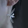 Nuevos aretes de perla y orquídea estilo chino, elegantes y refinados, con artesanía de perlas y un diseño floral fresco