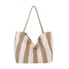 Bolso tipo cubo a rayas de bloques de color único para mujer, nuevo bolso de hombro y cruzado de moda 2026, bolso tote a la moda para niñas