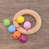 Bebés de madera y niños pequeños pueden morder la campana de mano para captar el entrenamiento auditivo de educación temprana, juego de cinco piezas de juguetes de regalo de nacimiento al por mayor