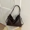 Bolso tote de color liso de gran capacidad, nuevo diseño de moda para principios de otoño de 2026, bolso de hombro nicho de alta apariencia para mujer