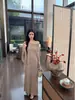 Chal tipo capa de estilo francés, vestido de punto rosa de dos piezas simulado sin hombros, nueva colección de otoño temprano 2026 para mujer, elegante vestido largo