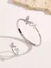 Moda Transfronteriza Europea y Americana Exquisito Conjunto de Anillo y Pulsera Completa de Diamantes Mariposa Madreperla Abrible Joyería de Mano de Pulsera de Lujo Ligero de Gama Alta