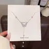 Collar de mariposa con microincrustaciones de circonita estilo coreano para mujer, lujo ligero, cadena para la clavícula elegante y sofisticada, aretes dulces para el día a día, venta al por mayor