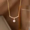 Collar de acero y titanio con doble anillo de amor para mujer, oro de 18 quilates, diseño de nicho de lujo ligero, sensación de elegancia, cadena de clavícula de celebridades de Internet, accesorios