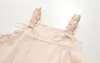 26019 Conjunto de dos piezas para mujer: falda con tirantes de retazos de encaje fresca y dulce + camisa blanca de manga corta con cordones