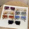 Novos Óculos de Sol de Metal Fashion Sem Aro Borda Cortada Armação Grande Perna Curva Letra Oca para Mulheres Estilo Coreano Tendência Estilo de Rua